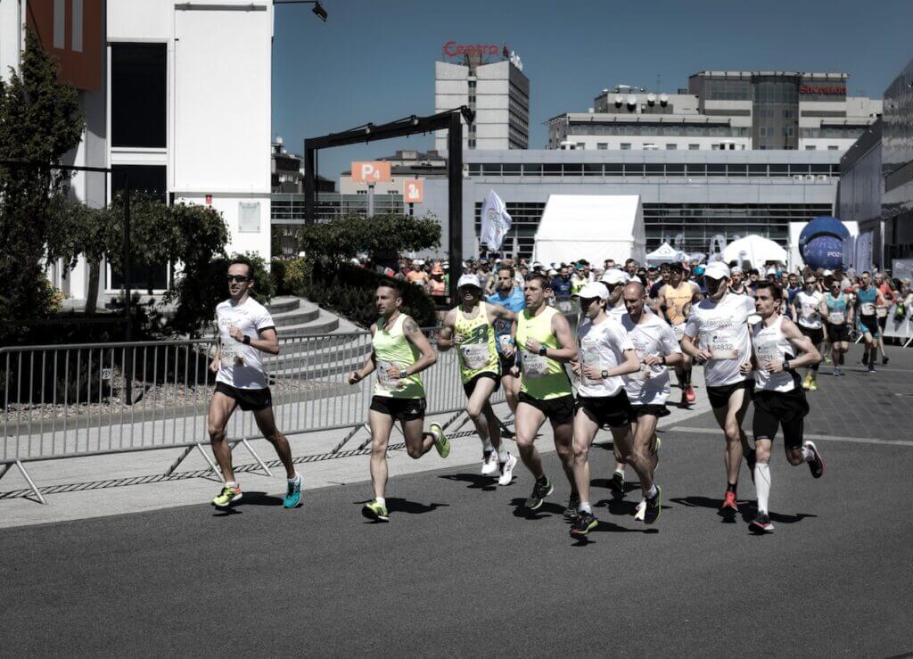 Group of marathon runners in the city with a proper posture