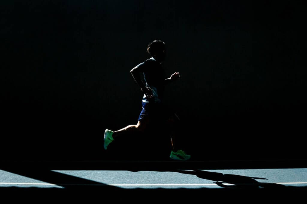 Man running fast in the dark