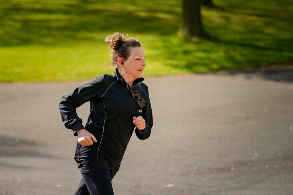Woman in Active Wear wanting to surpass the average 3 mile run time